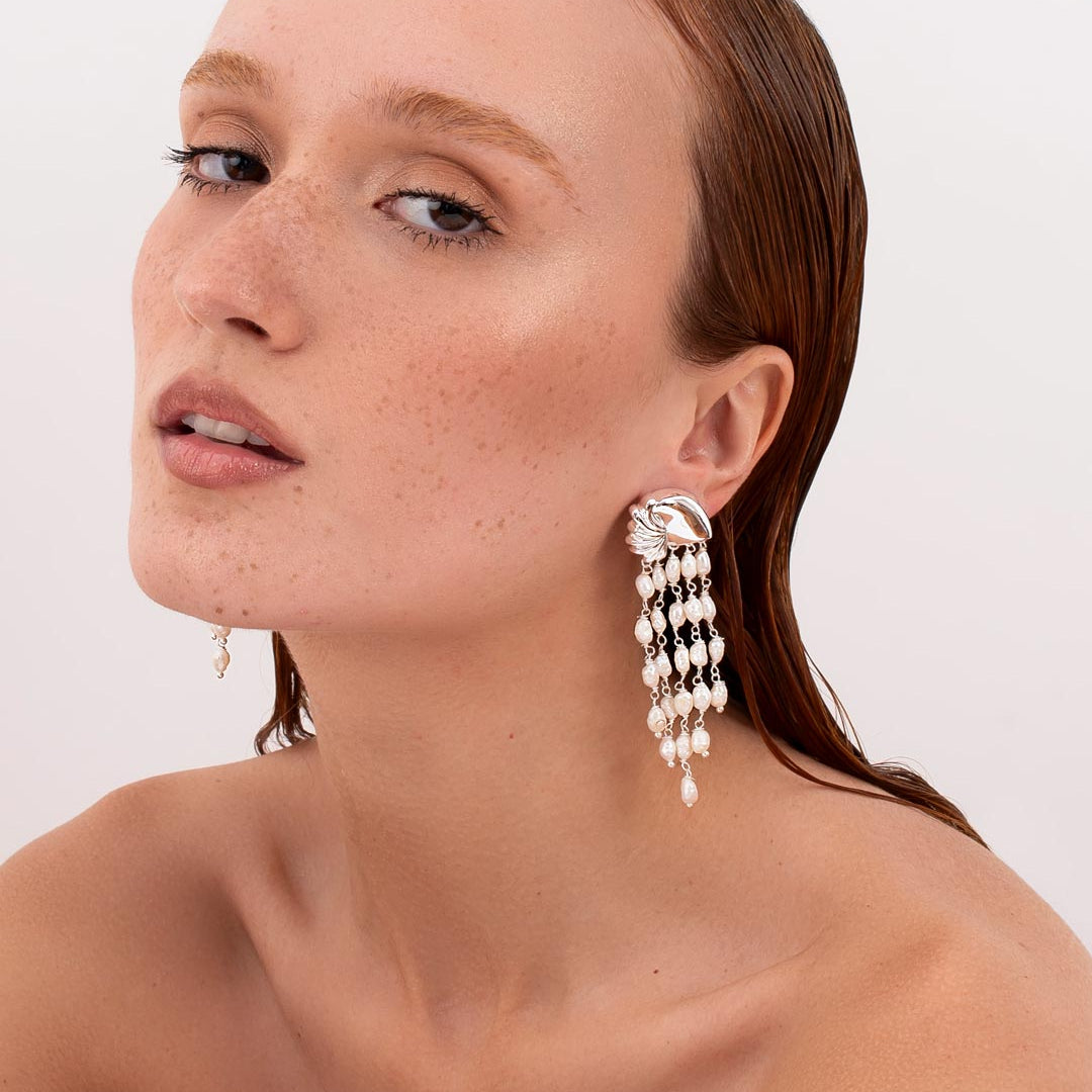 Statement pearl drop earrings in editorial styling