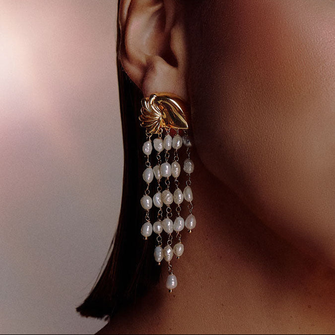 Statement pearl cascade earrings with sculptural gold design